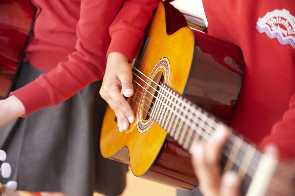 A child playing the guitar
