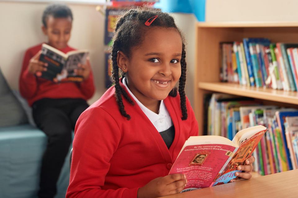 Picture of a child reading a book